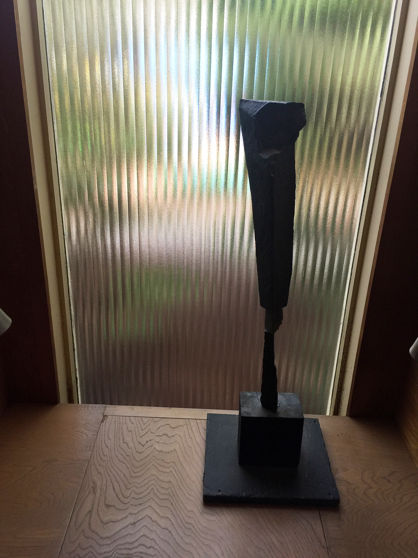 16c. Tabletop sculpture made of basalt.